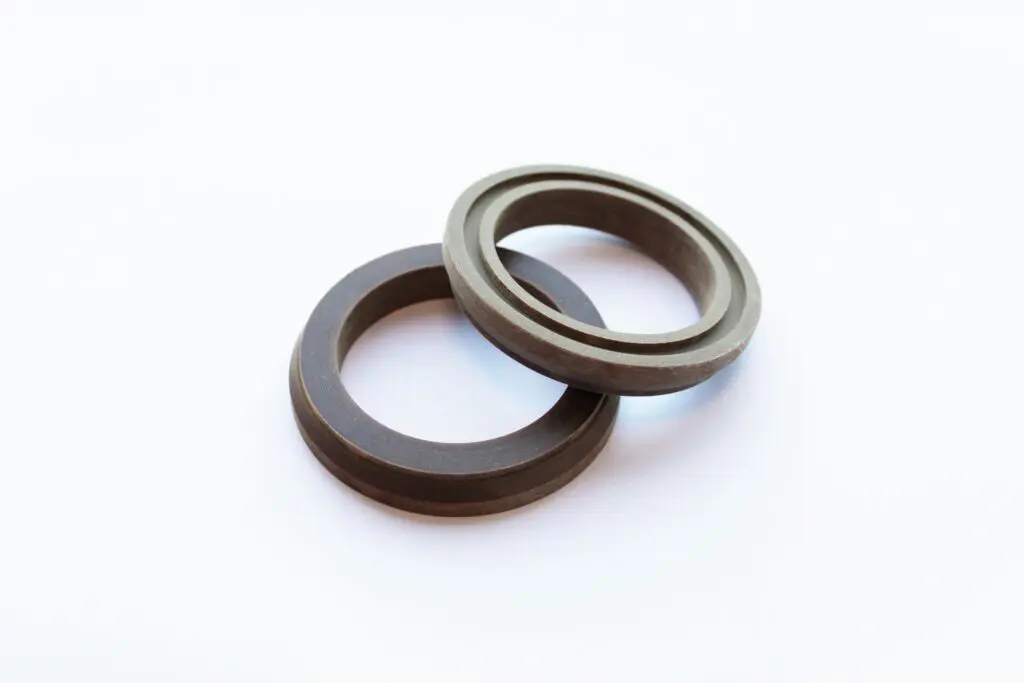 Two metal rings, crafted with SRBP material, overlap each other on a white background.