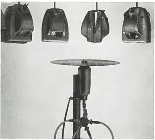 Picture17 A mechanical percussion instrument with a cymbal and four suspended hammers above it.