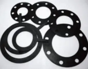 Five black rubber gaskets of varying sizes with holes, arranged overlapping on a white background.