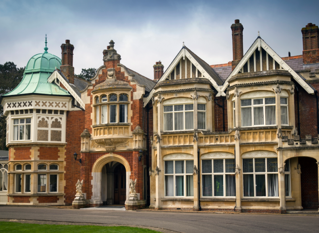 Historic manor house with ornate windows, a domed turret. Bletchley Park.
