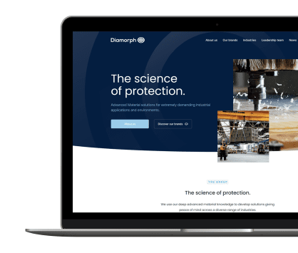 A laptop displays a website with the heading The science of protection and industrial images.